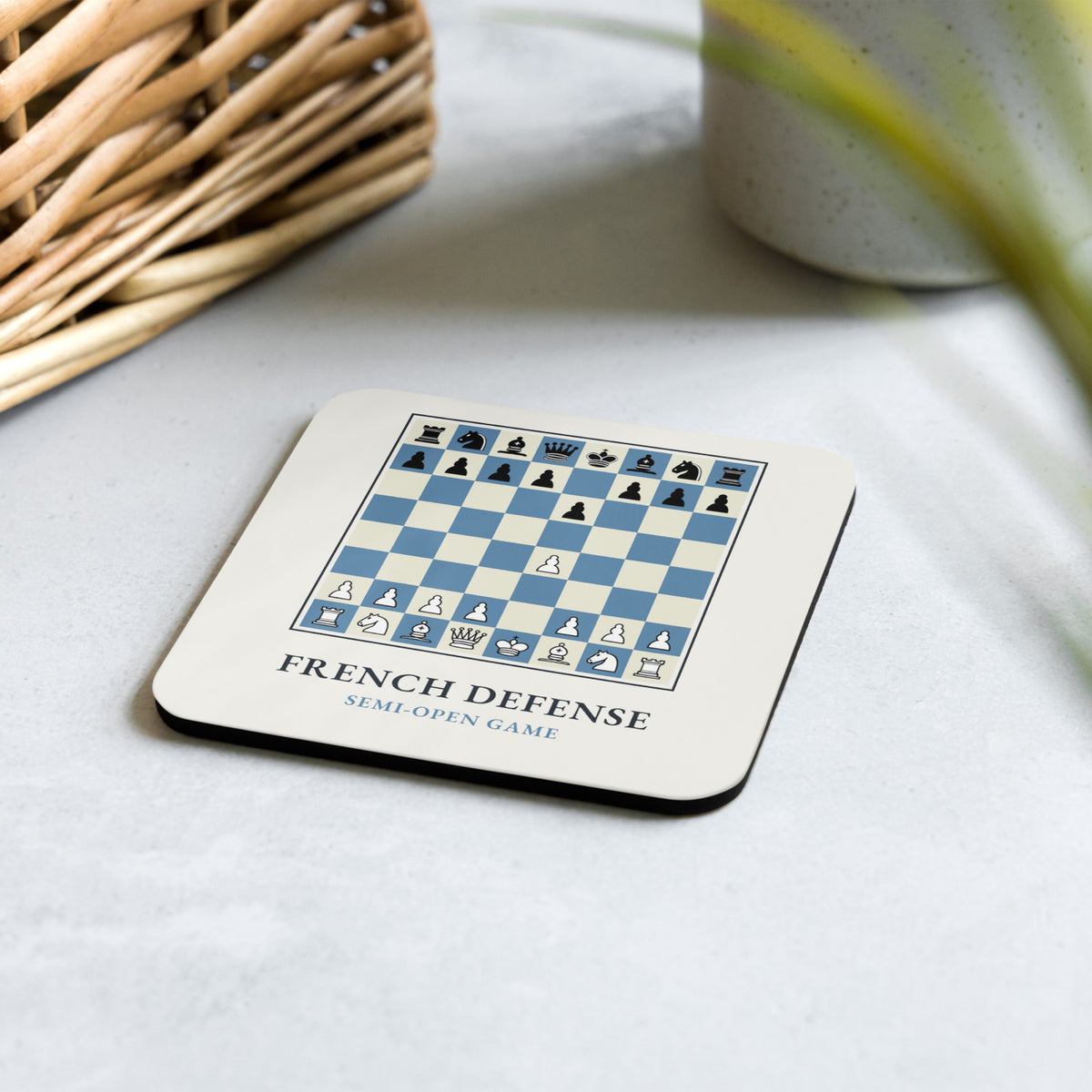 French Defense Chess Coaster on a light stone table
